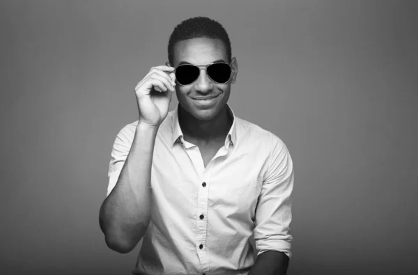 Smiling african man on black and white tone