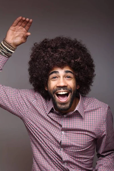 Happy black man with big hair