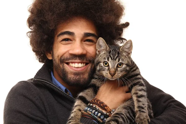 Black man holding cat in hands