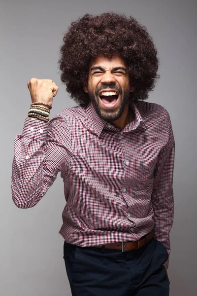 Screaming black man with big hair