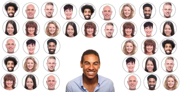 Afroamerikanischer Mann Lächelt Auf Hintergrund Von Ikonen Mit Menschengesichtern — Stockfoto