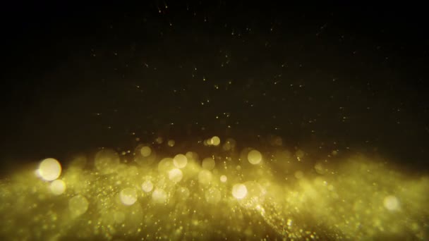 黄金のきらめく光が抽象的なアニメーション シームレスなループを引き起こす — ストック動画