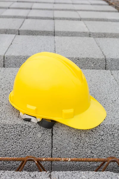 Close view of colorful helmet on building site