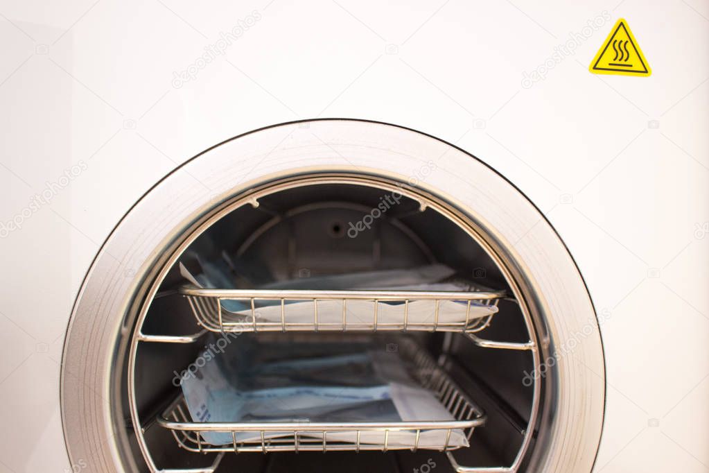 Sterilizing medical instruments in autoclave. Equipment for sterile cleaning of working medical instruments