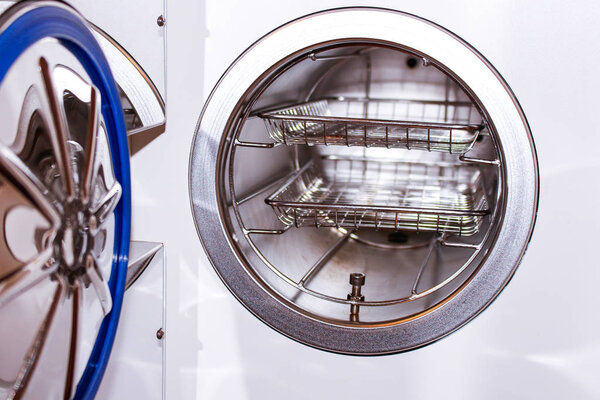 Sterilizing medical instruments in autoclave. Equipment for sterile cleaning of working medical instruments.