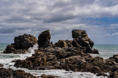 Batı yakası kayalık plajı, Cape Foulwind, Westport, Yeni Zelanda, Yeni Zelanda 'da inanılmaz bir pelerin faul rüzgarı plajı.