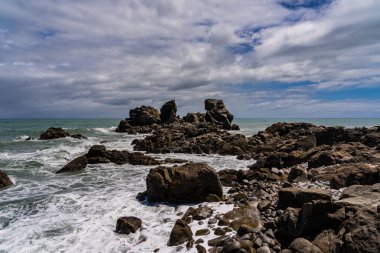 Batı yakası kayalık plajı, Cape Foulwind, Westport, Yeni Zelanda, Yeni Zelanda 'da inanılmaz bir pelerin faul rüzgarı plajı.