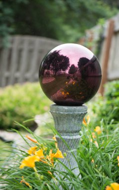 Closeup of gazing ball in the garden clipart