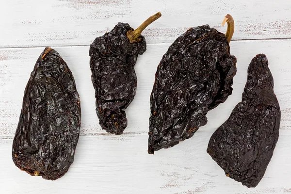 Four Poblano Chile Peppers Stock Image