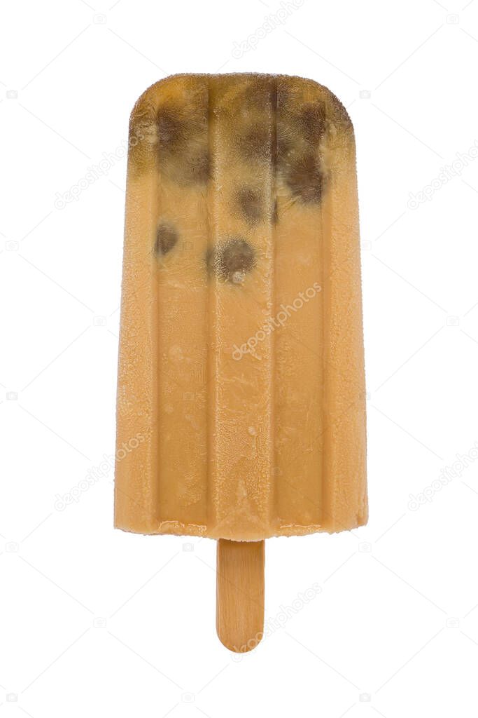 A homemade frozen black tea boba popsicle against a white background.