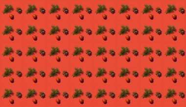 Köknar dalı ve kırmızı arka planda bir koni olan yaratıcı desen. Noel Konsepti