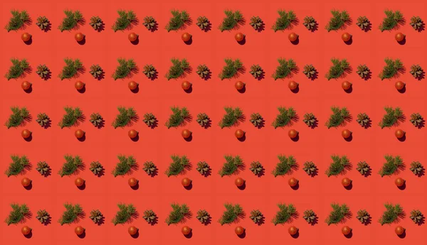 Köknar dalı ve kırmızı arka planda bir koni olan yaratıcı desen. Noel Konsepti