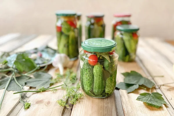 Fresh cucumbers ready for canning and pickling with dill, garlic and spices on a wooden table and in glass jars — Stock Image Fresh Cucumbers Ready Canning Pickling Dill Garlic Spices Wooden Table Royalty Free Stock Photos
