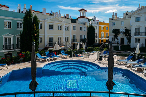 Poolside at the at the Old Village, a tranquil setting in The Algarve, surrounded by the Pinhal Golf Course and close to pristine beaches