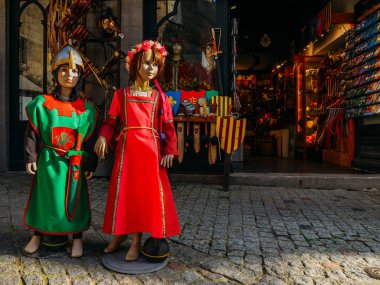 Dolls dressed in medieval clothes in the historic centre of Carcassonne, a hilltop town in southern France clipart