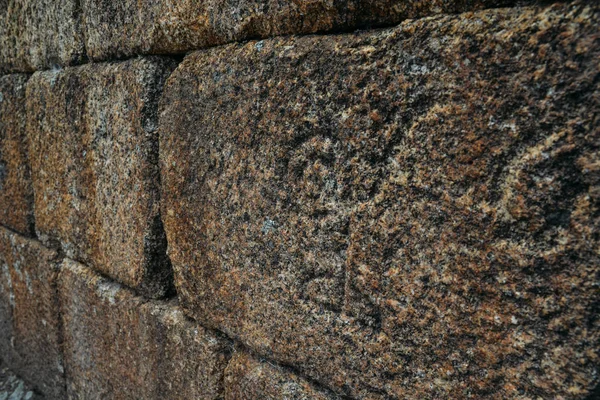 Symbolic carvings on castle wall - Sortelha, Portugal