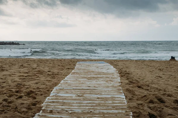 Surfers out of the water during a stormy day in San Sebastian, Basque Country — Stock Photo, Image