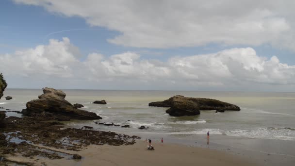 Families relax at the Grande Plage beach in Biarritz, Aquitaine France, a popular resort town on the Bay of Biscay — Stock Video