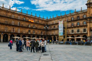 Tourists at the famous and historic Plaza Mayor in Salamanca, Castilla y Leon, Spain - UNESCO World Heritage Site clipart
