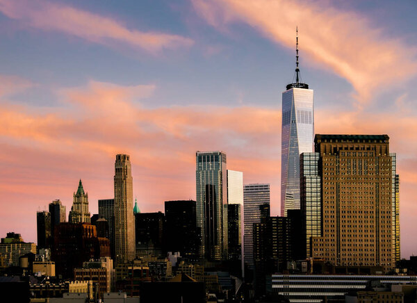 Manhattan, New York City, USA sunset downtown skyline skyscrapers at Magenta coloured sunset
