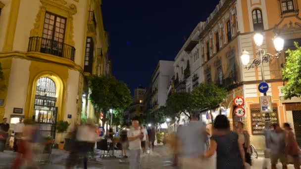 Time lapse at the historic centre of Seville servicing Spanish style tapas to locals and tourists well into the late hours. Seville is famous for its lively nightlife — Stock Video