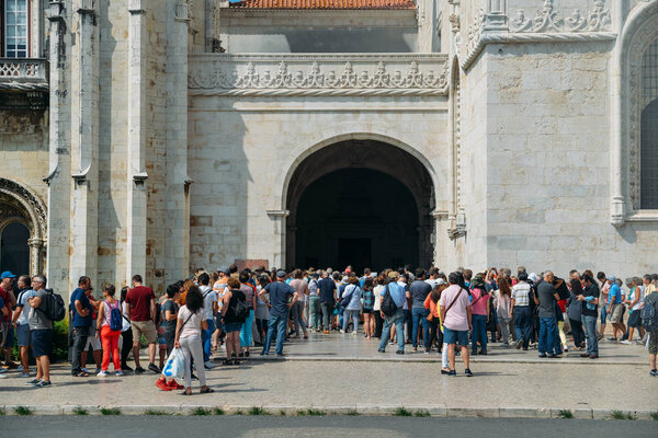 Crowd of people at entrance of Hieronymites Monastery or Mosteiro dos Jeronimos. The monastery is one of the citys main attractions - UNESCO World Heritage Site