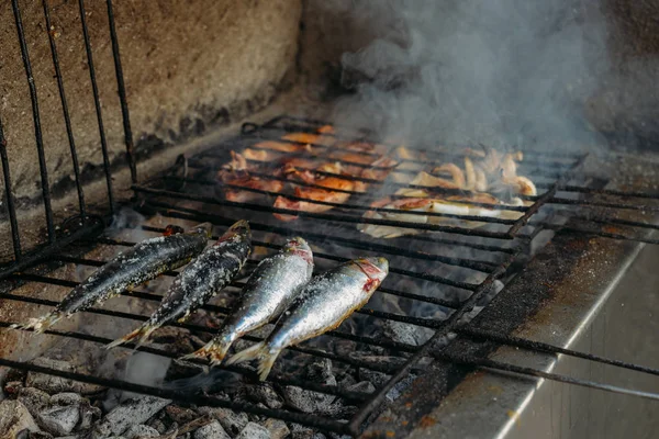 Grilled salty mackerel fish on the grill closeup — Stock Image Grilled salty mackerel fish on the grill closeup Royalty Free Stock Images