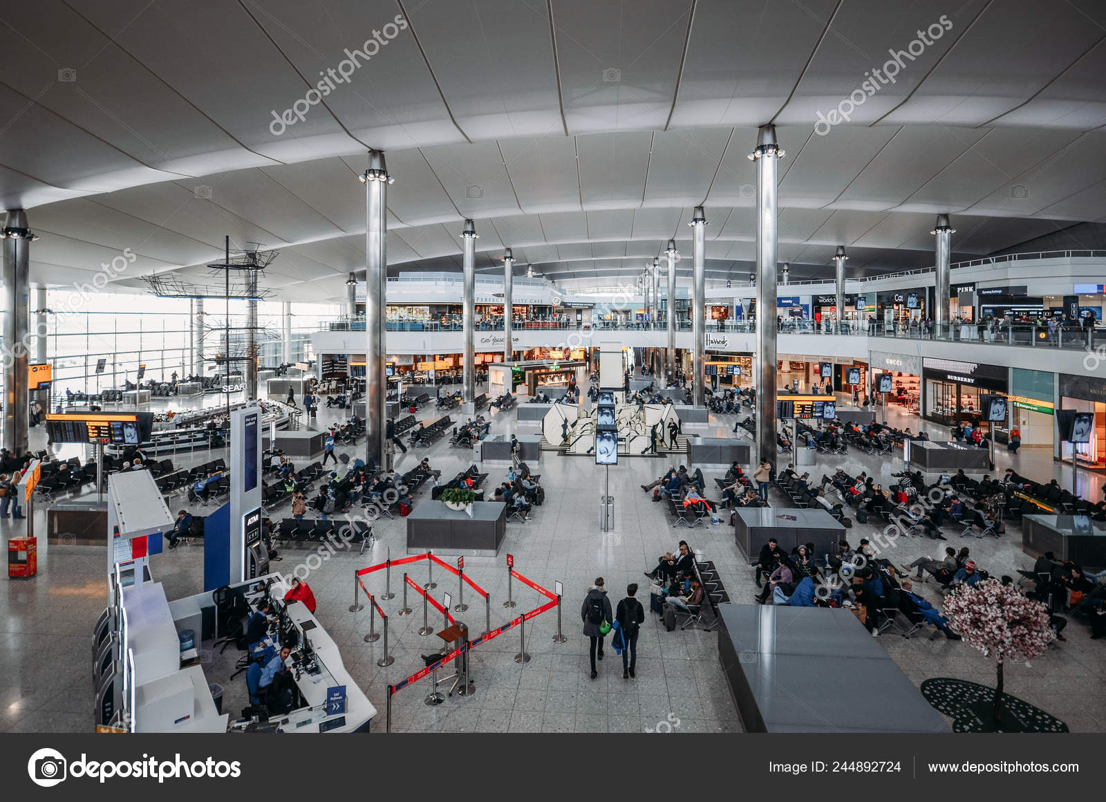 High Perspective View Of Passengers And Shops At Departure