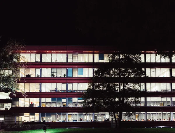 Empty office building at night with lights still on