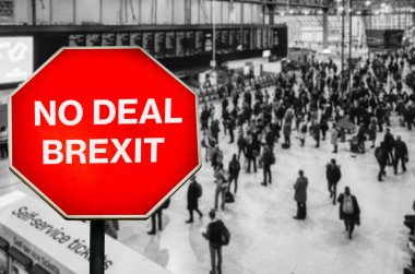 No Deal Brexit written on octagon stop sign with high perspective view defocused passengers at British train station terminal clipart