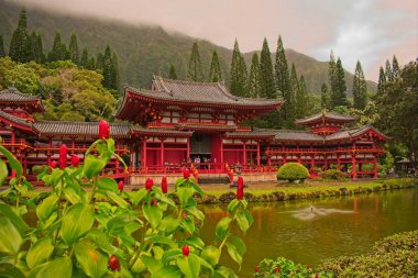 View to the Byodo-In Temple and the mountains in Kaneohe, Hawaii. clipart