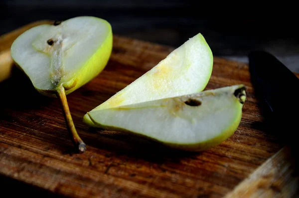 Sliced pears chopped on a kitchen board.