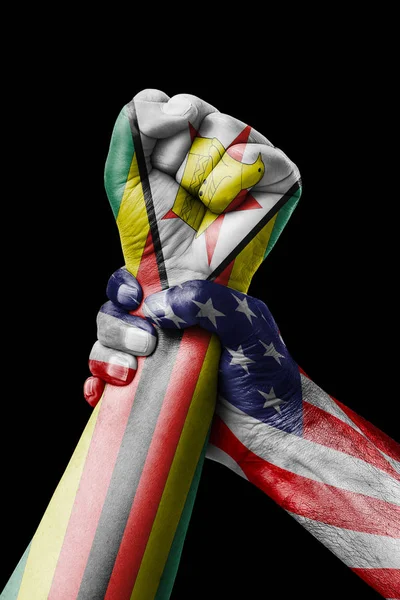 AMERICAN VS Zimbabwe, Fist painted in colors of Zimbabwe flag, fist flag, country of Zimbabwe