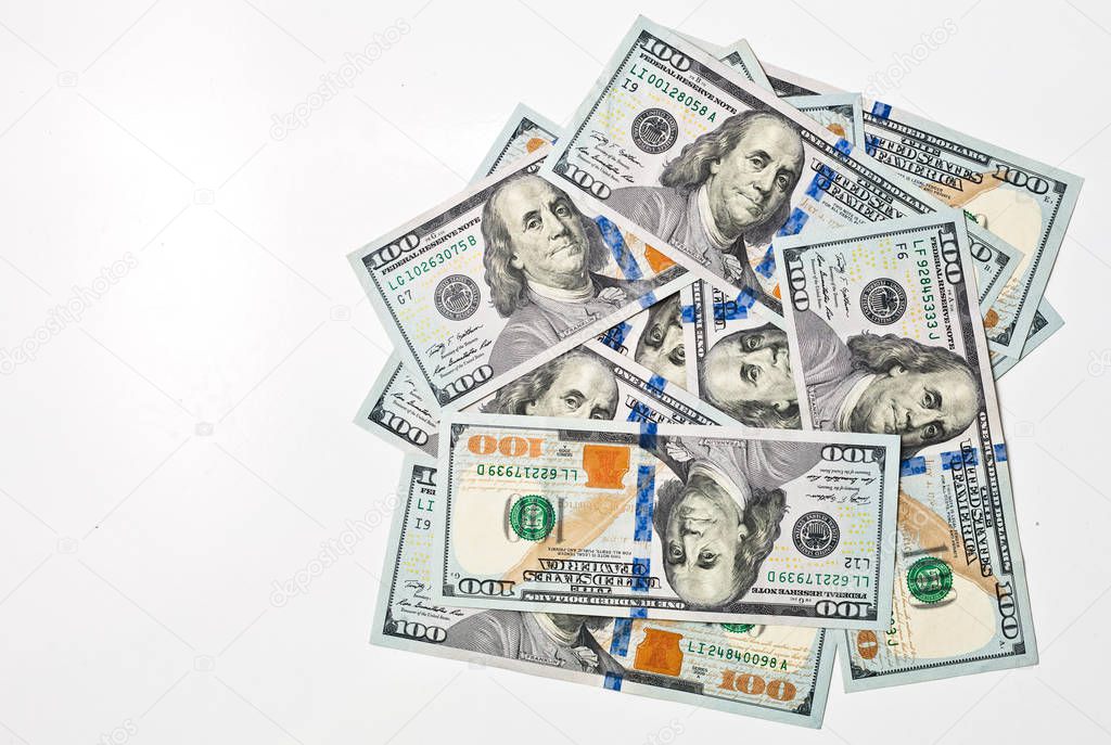 A pile of one hundred US banknotes with president portraits. Cash of hundred dollar bills, dollar background image with high resolution