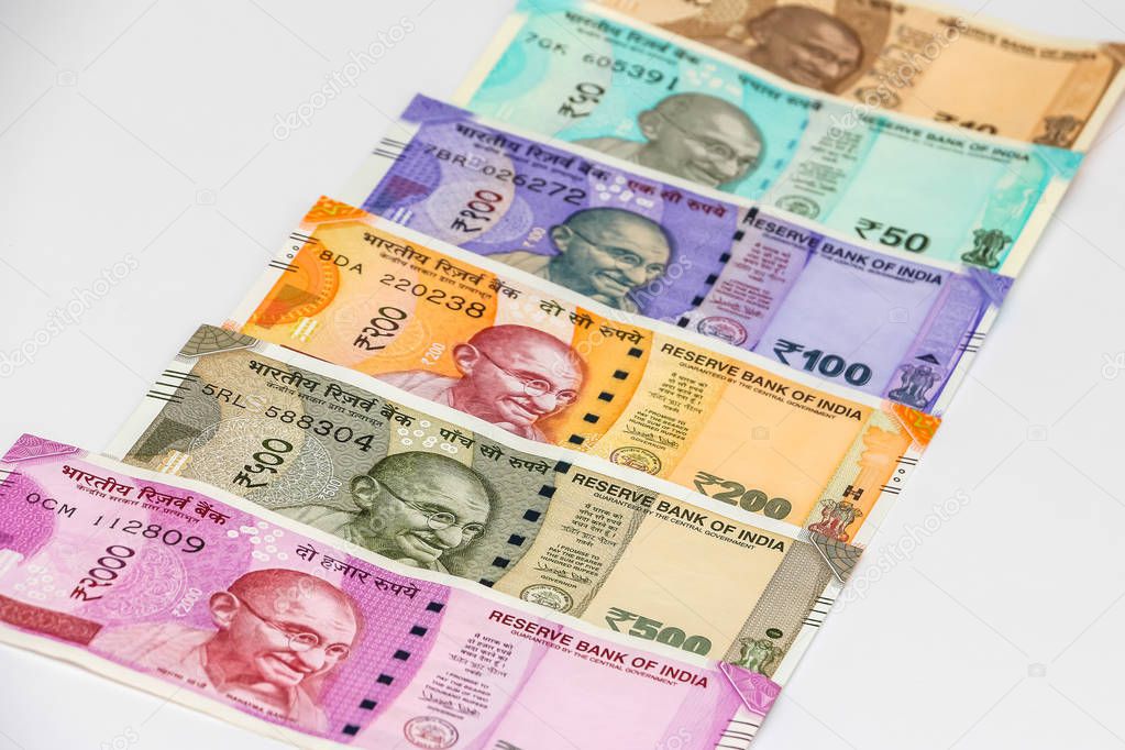 Close up view of brand new indian 10, 50, 100, 200, 500 and 2000 rupees banknotes. Colorful money background.