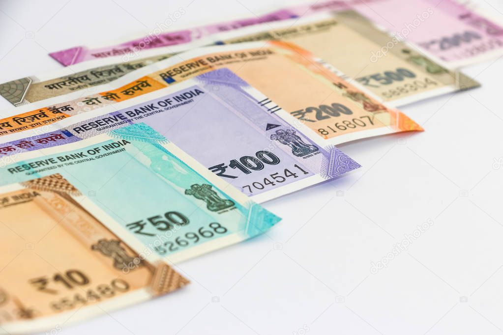 Close up view of brand new indian 10, 50, 100, 200, 500 and 2000 rupees banknotes. Colorful money background.