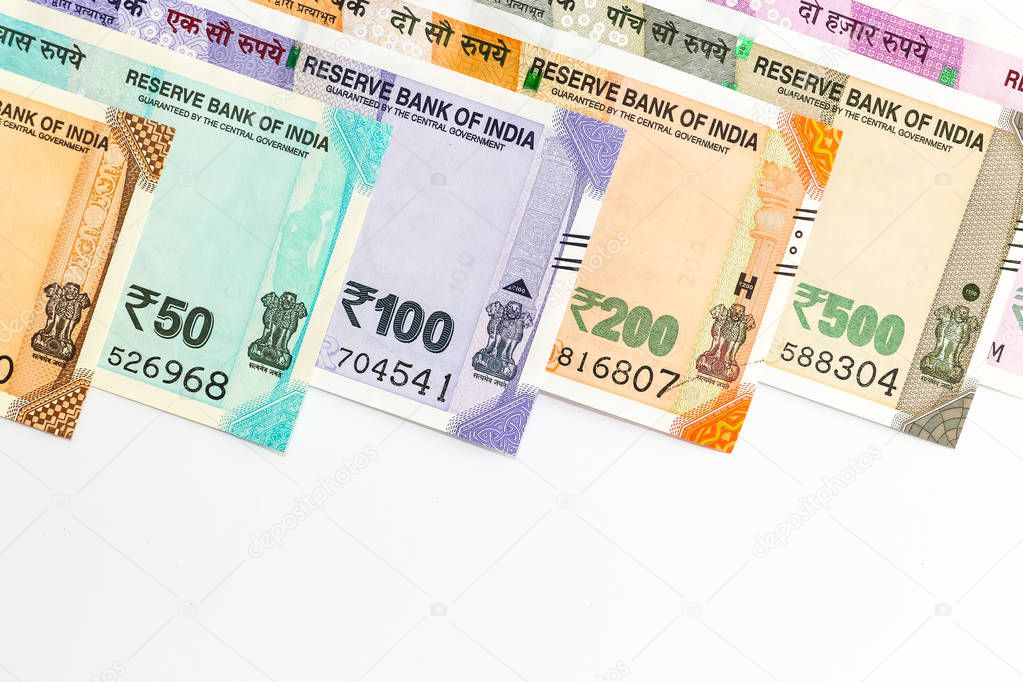 Close up view of brand new indian 10, 50, 100, 200, 500 and 2000 rupees banknotes. Colorful money background.