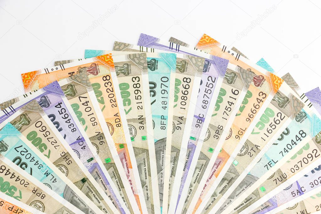 Close up view of brand new indian 50, 100, 200, 500 rupees banknotes. Colorful money ornamental background.