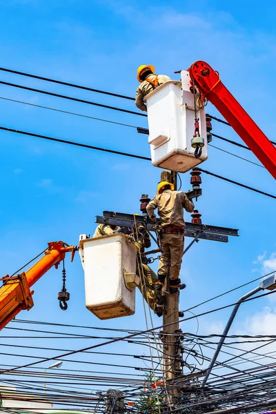 The electrical worker are repairing the electrical system