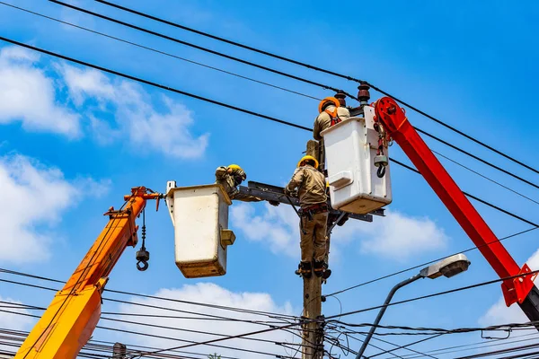 The electrical worker are repairing the electrical system