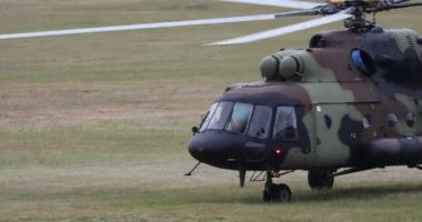 detail of the front of a military transport helicopter , who has just landed
