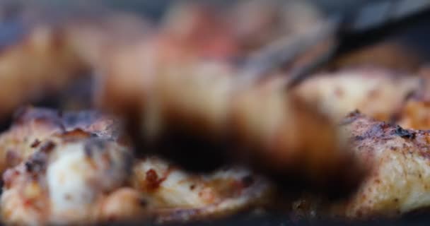 Man Large Fork Removes Grilled Chicken Wings Grill Shallow Depth — Stock Video