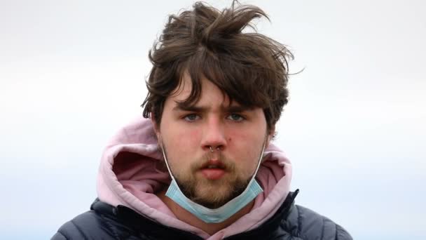 Boy Putting Face Mask Pandemic Lock Windy Day — Stock Video