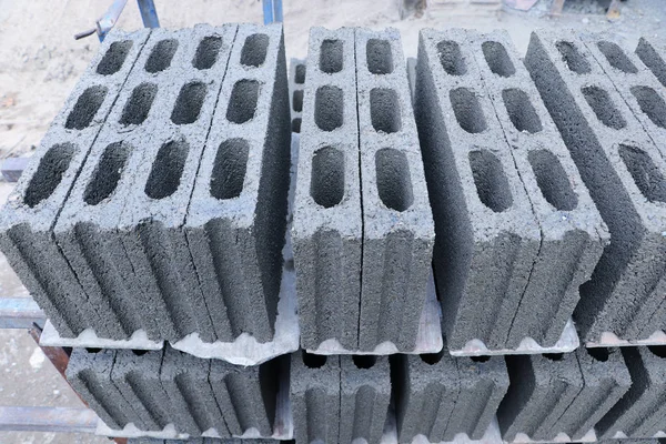 Stacking of concrete blocks laying on the floor at the factory ready to be transported to construction site - construction materials