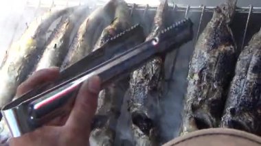 fishermen grill fish, shrimp, mussels, on the boat