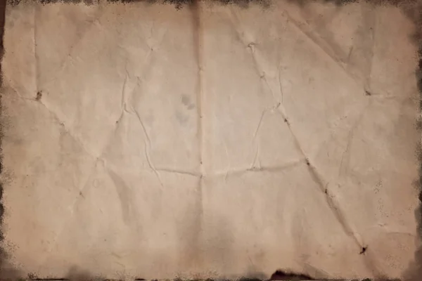 Старая коричневая скомканная бумага, обгоревшая по краям, текстура фона — стоковое фото