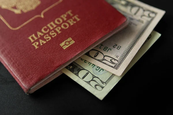 Euro and dollar banknotes laid out in a passport, close-up — Stock Photo, Image