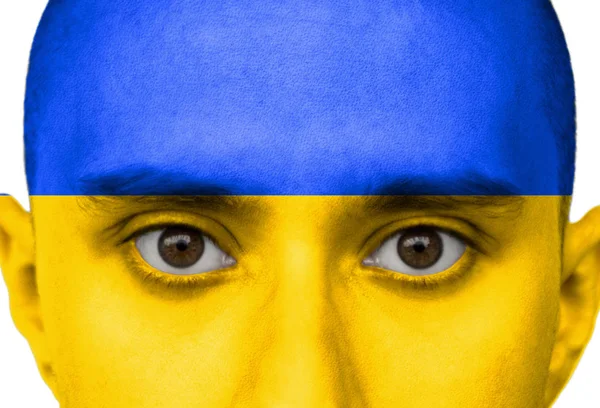 Národní vlajka Ukrajina barevně zbarvená v barvě na tváři muže zblízka, izolovaná na bílém pozadí — Stock fotografie