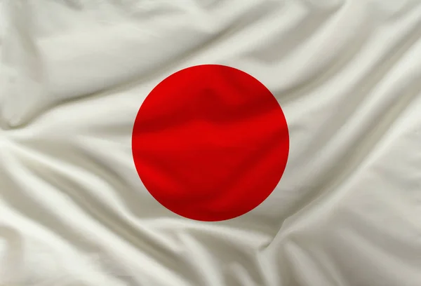 Color Japón bandera nacional sobre textil drapeado, fondo — Foto de Stock