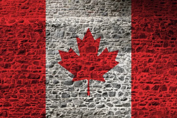 Kanada ulusal bayrağı kaba bir taş duvara boyanmış — Stok fotoğraf
